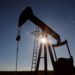 U.S. crude futures turn positive after historic slide, Brent dips